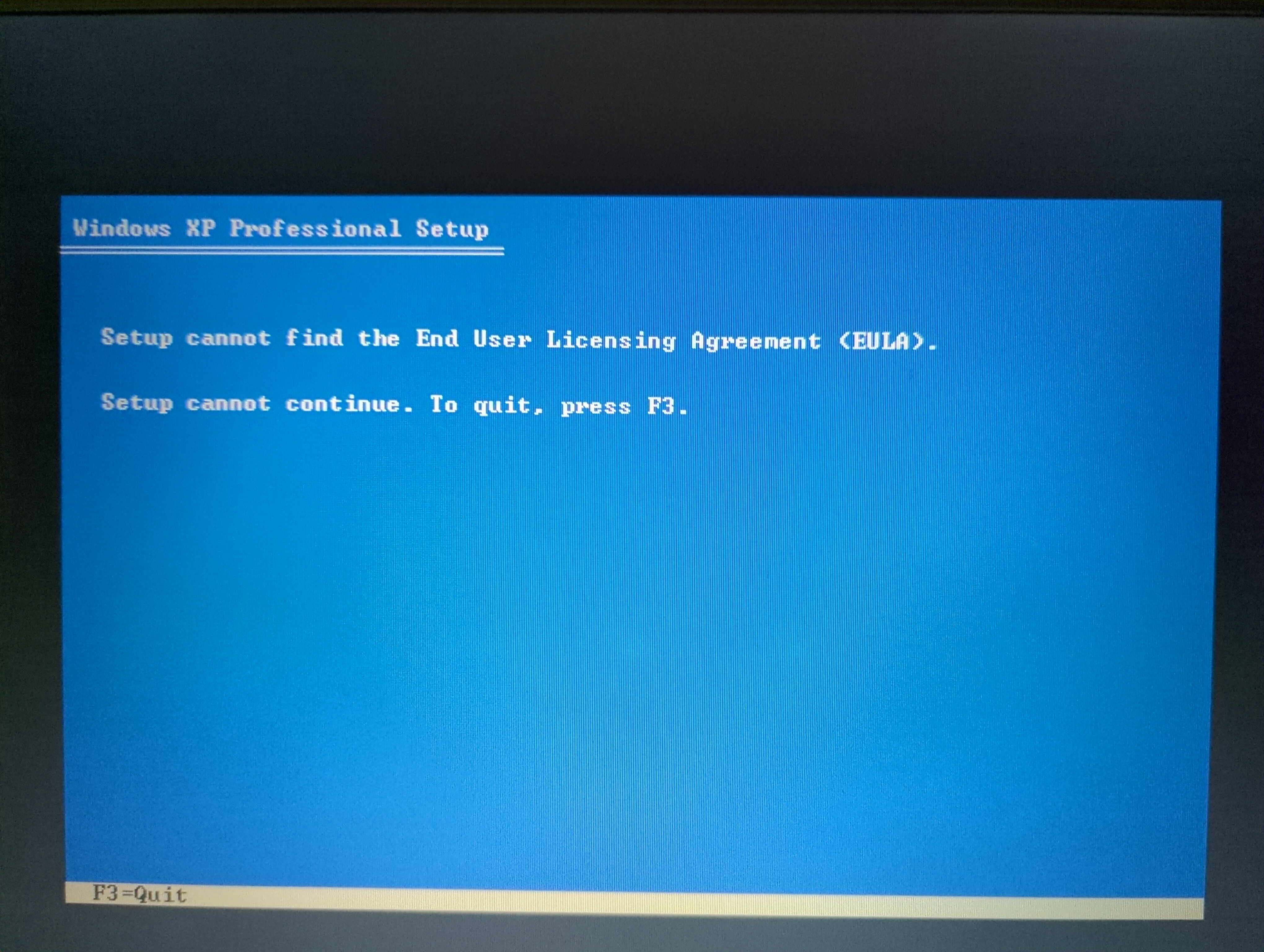 Windows XP setup missing the EULA Photo of the Windows XP installer. The error message reads “Setup cannot find the End User Licensing Agreement (EULA).”